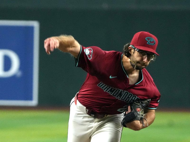 Jun 29, 2024; Phoenix, Arizona, USA; Arizona Diamondbacks pitcher Zac Gallen (23) throws against the Oakland Athletics in the first inning at Chase Field. Mandatory Credit: Rick Scuteri-USA TODAY Sports