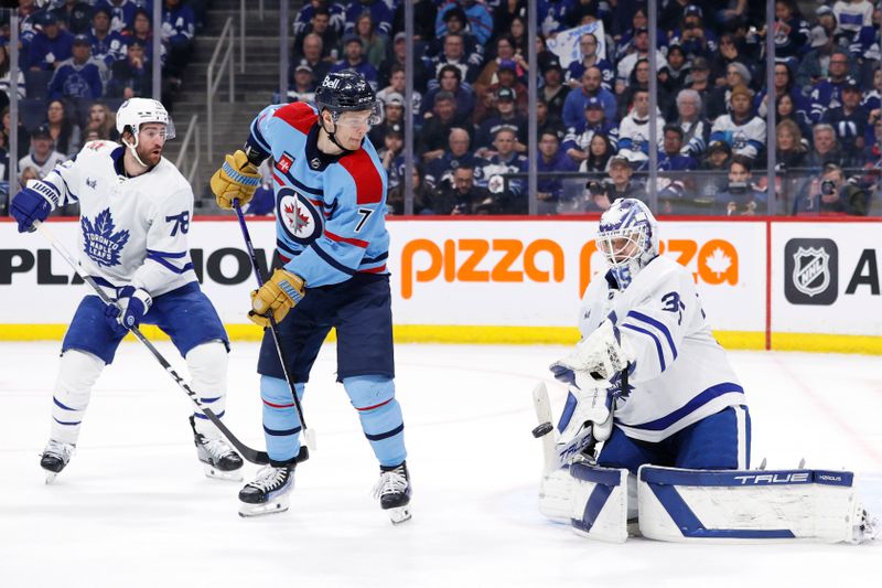 Jan 27, 2024; Winnipeg, Manitoba, CAN; Toronto Maple Leafs goaltender Ilya Samsonov (35) blocks a shot watched by Winnipeg Jets center Vladislav Namestnikov (7) in the second period at Canada Life Centre. Mandatory Credit: James Carey Lauder-USA TODAY Sports