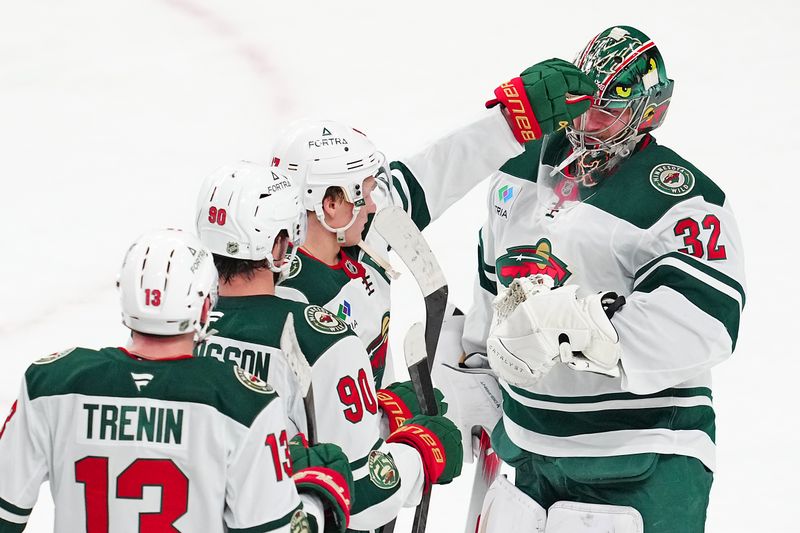 Dec 29, 2025; Las Vegas, Nevada, USA; Minnesota Wild left wing Kirill Kaprizov (97) congratulates Minnesota Wild goaltender Filip Gustavsson (32) after the Wild defeated the Vegas Golden Knights 5-2 at T-Mobile Arena. Mandatory Credit: Stephen R. Sylvanie-Imagn Images
