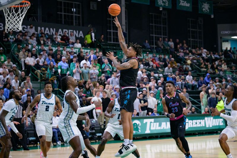 Jan 11, 2024; New Orleans, Louisiana, USA; Florida Atlantic Owls forward Giancarlo Rosado (3) shoots against Tulane Green Wave forward Kevin Cross (24) during the first half at Avron B. Fogelman Arena in Devlin Fieldhouse. Mandatory Credit: Matthew Hinton-USA TODAY Sports