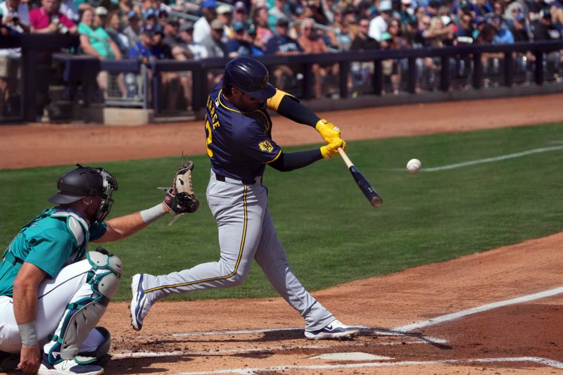 Mar 14, 2024; Peoria, Arizona, USA; Milwaukee Brewers catcher Eric Haase (13) bats against the Seattle Mariners during the second inning at Peoria Sports Complex. Mandatory Credit: Joe Camporeale-USA TODAY Sports