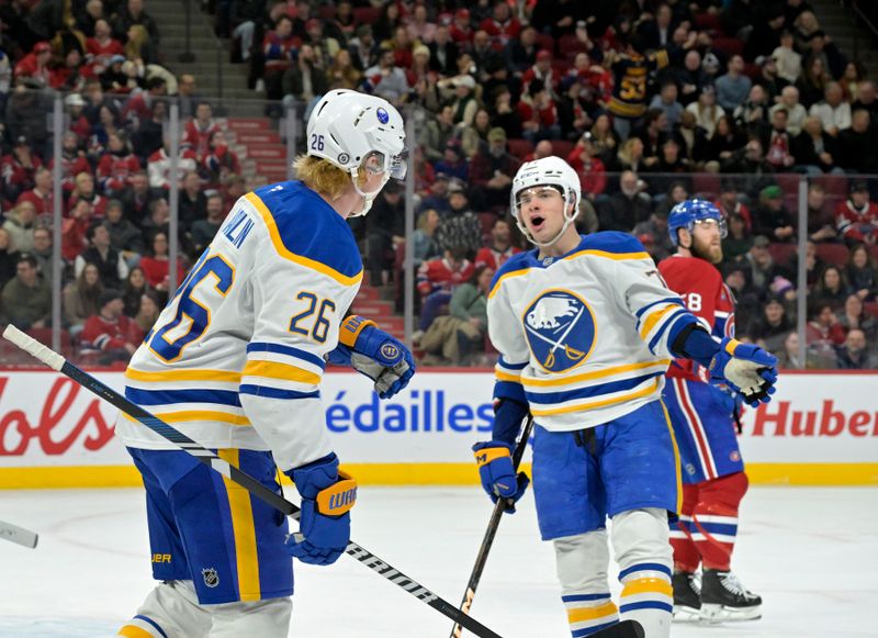 Mar 3, 2025; Montreal, Quebec, CAN; Buffalo Sabres defenseman Rasmus Dahlin (26) celebrates with teammate  forward JJ Peterka (77) after scoring a goal against the Montreal Canadiens during the overtime period at the Bell Centre. Mandatory Credit: Eric Bolte-Imagn Images