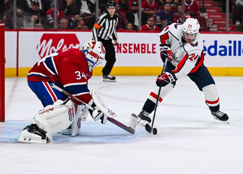 Oct 21, 2023; Montreal, Quebec, CAN; Montreal Canadiens goalie Jake Allen (34) makes a save against Washington Capitals center Connor McMichael (24) during the third period at Bell Centre. Mandatory Credit: David Kirouac-USA TODAY Sports