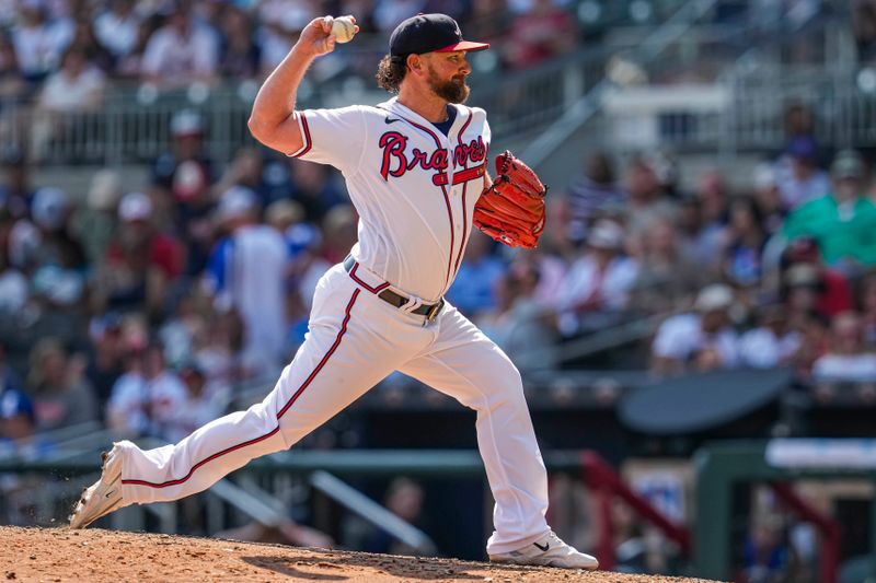 Aug 20, 2023; Cumberland, Georgia, USA; Atlanta Braves relief pitcher Kirby Yates (22) pitches against the San Francisco Giants during the ninth inning at Truist Park. Mandatory Credit: Dale Zanine-USA TODAY Sports