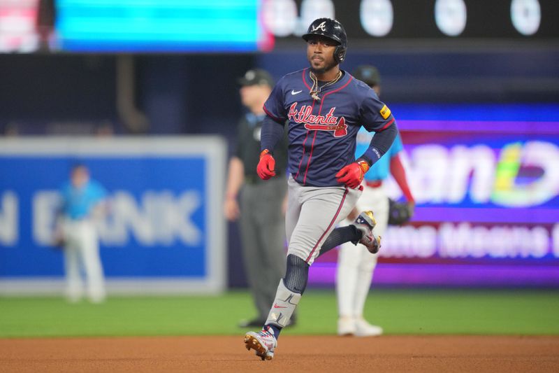 Sep 22, 2024; Miami, Florida, USA;  Atlanta Braves second baseman Ozzie Albies (1) rounds second base after hitting a home run against the Miami Marlins in the first inning at loanDepot Park. Mandatory Credit: Jim Rassol-Imagn Images