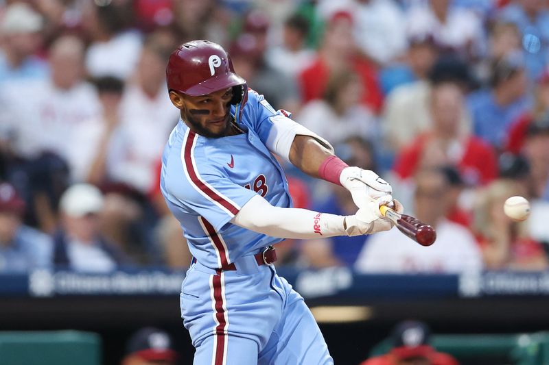 Aug 15, 2024; Philadelphia, Pennsylvania, USA; Philadelphia Phillies outfielder Johan Rojas (18) hits an RBI single during the fourth inning against the Washington Nationals at Citizens Bank Park. Mandatory Credit: Bill Streicher-USA TODAY Sports