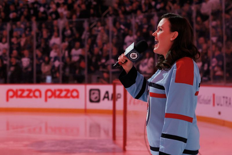 Jan 27, 2024; Winnipeg, Manitoba, CAN; Stacey Nattrass sings the Canadian National anthem before a game between the Winnipeg Jets and the Toronto Maple Leafs at Canada Life Centre. Mandatory Credit: James Carey Lauder-USA TODAY Sports