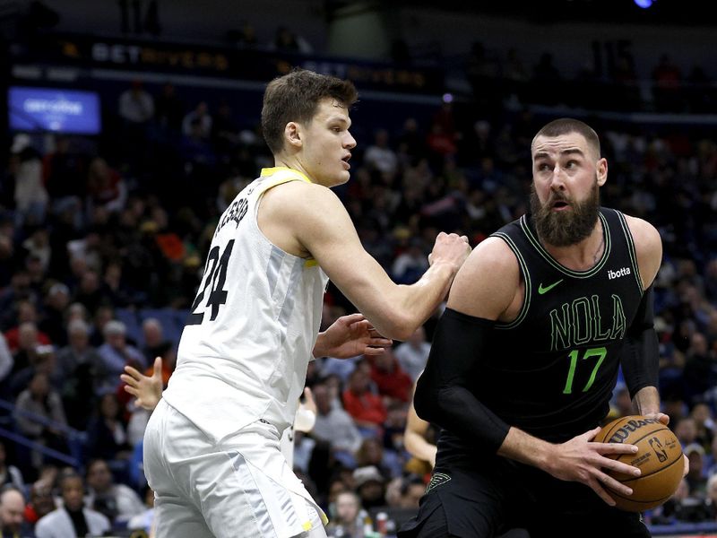 NEW ORLEANS, LOUISIANA - JANUARY 23: Jonas Valanciunas #17 of the New Orleans Pelicans is defended by Walker Kessler #24 of the Utah Jazz during the third quarter of an NBA game at Smoothie King Center on January 23, 2024 in New Orleans, Louisiana. NOTE TO USER: User expressly acknowledges and agrees that, by downloading and or using this photograph, User is consenting to the terms and conditions of the Getty Images License Agreement. (Photo by Sean Gardner/Getty Images)