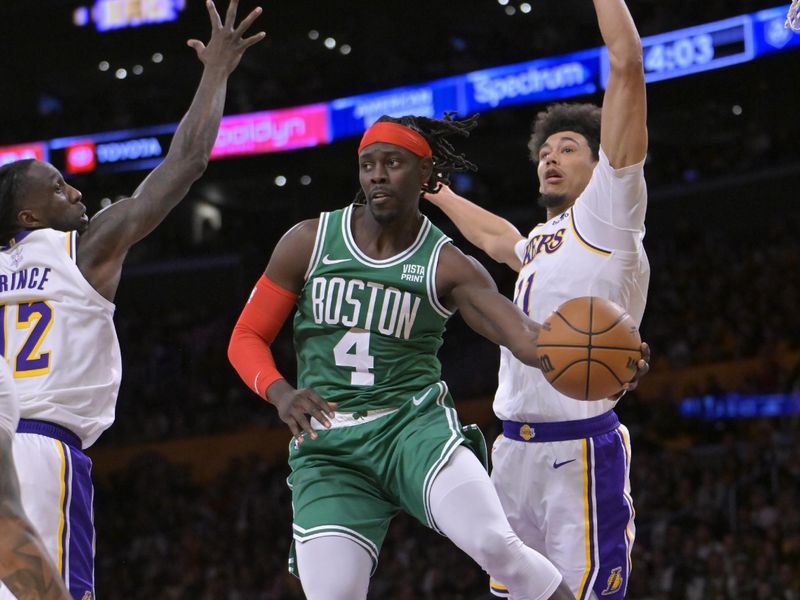 LOS ANGELES, CALIFORNIA - DECEMBER 25: Jrue Holiday #4 of the Boston Celtics is defended by Taurean Prince #12 and Jaxson Hayes #11 of the Los Angeles Lakers as he passes the ball in the second half at Crypto.com Arena on December 25, 2023 in Los Angeles, California. NOTE TO USER: User expressly acknowledges and agrees that, by downloading and or using this photograph, User is consenting to the terms and conditions of the Getty Images License Agreement.(Photo by Jayne Kamin-Oncea/Getty Images)