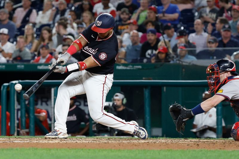 Sep 11, 2024; Washington, District of Columbia, USA; Washington Nationals catcher Keibert Ruiz (20) hits an RBI single against the Atlanta Braves during the eighth inning at Nationals Park. Mandatory Credit: Geoff Burke-Imagn Images