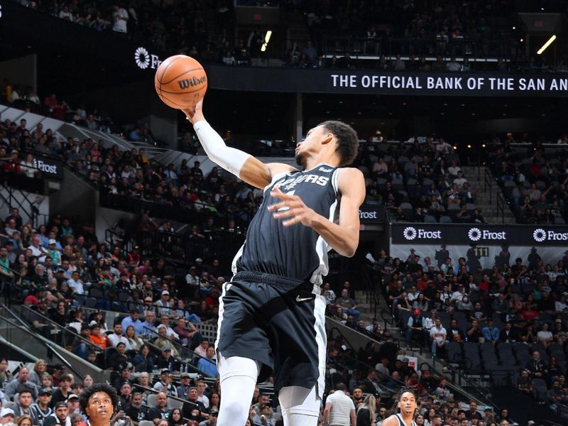 SAN ANTONIO, TX - MARCH 12: Victor Wembanyama #1 of the San Antonio Spurs grabs the rebound during the game against the Houston Rockets on March 12, 2024 at the Frost Bank Center in San Antonio, Texas. NOTE TO USER: User expressly acknowledges and agrees that, by downloading and or using this photograph, user is consenting to the terms and conditions of the Getty Images License Agreement. Mandatory Copyright Notice: Copyright 2024 NBAE (Photos by Michael Gonzales/NBAE via Getty Images)