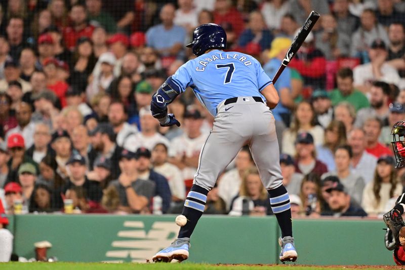 Sep 27, 2024; Boston, Massachusetts, USA; Tampa Bay Rays shortstop Jose Caballero (7) is hit by a pitch during the seventh inning against the Boston Red Sox at Fenway Park. Mandatory Credit: Eric Canha-Imagn Images