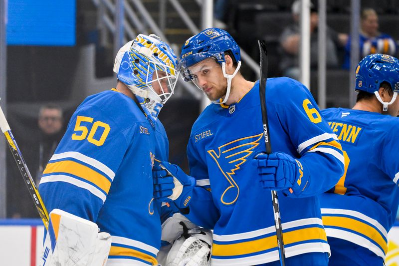 Oct 2, 2025; St. Louis, Missouri, USA; St. Louis Blues goaltender Jordan Binnington (50) celebrates with defenseman Philip Broberg (6) after the Blues defeated the Ottawa Senators at Enterprise Center. Mandatory Credit: Jeff Curry-Imagn Images