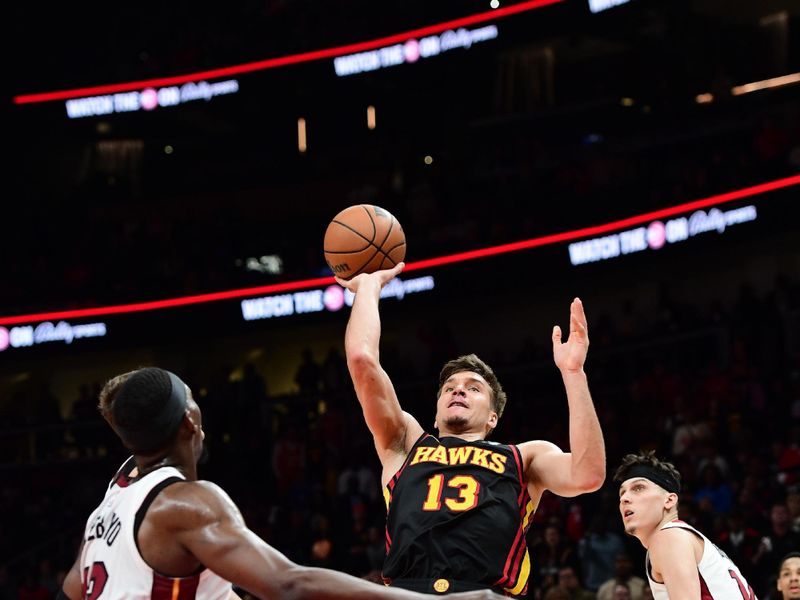 ATLANTA, GA - APRIL 9: Bogdan Bogdanovic #13 of the Atlanta Hawks shoots the ball during the game against the Miami Heat  on April 9, 2024 at State Farm Arena in Atlanta, Georgia.  NOTE TO USER: User expressly acknowledges and agrees that, by downloading and/or using this Photograph, user is consenting to the terms and conditions of the Getty Images License Agreement. Mandatory Copyright Notice: Copyright 2024 NBAE (Photo by Scott Cunningham/NBAE via Getty Images)