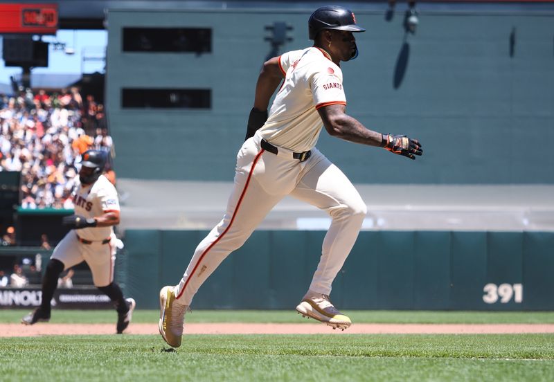 Jun 30, 2024; San Francisco, California, USA; San Francisco Giants designated hitter Jorge Soler (2) runs home followed by center fielder Heliot Ramos (17) for a two-run RBI double against the Los Angeles Dodgers during the fourth inning at Oracle Park. Mandatory Credit: Kelley L Cox-USA TODAY Sports