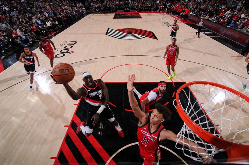 PORTLAND, OR - APRIL 9: Duop Reath #26 of the Portland Trail Blazers shoots the ball during the game against the New Orleans Pelicans on April 9, 2024 at the Moda Center Arena in Portland, Oregon. NOTE TO USER: User expressly acknowledges and agrees that, by downloading and or using this photograph, user is consenting to the terms and conditions of the Getty Images License Agreement. Mandatory Copyright Notice: Copyright 2024 NBAE (Photo by Cameron Browne/NBAE via Getty Images)