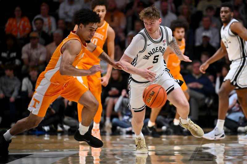 Feb 21, 2026; Nashville, Tennessee, USA;  Tennessee Volunteers guard Bishop Boswell (3) steals the ball from Vanderbilt Commodores forward Tyler Nickel (5) during the first half at Memorial Gymnasium. Mandatory Credit: Steve Roberts-Imagn Images