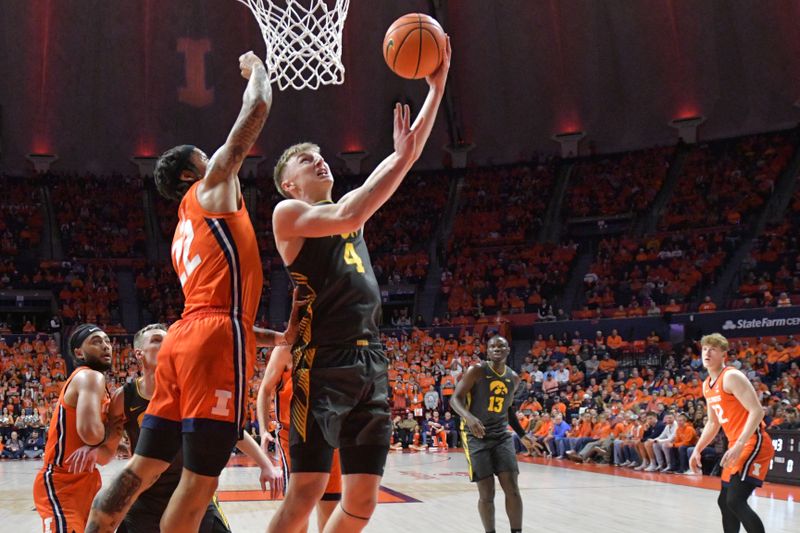 Feb 25, 2025; Champaign, Illinois, USA;  Iowa Hawkeyes guard Josh Dix (4) drives to the basket at Illinois Fighting Illini guard Tre White (22) defends during the first half at State Farm Center. Mandatory Credit: Ron Johnson-Imagn Images