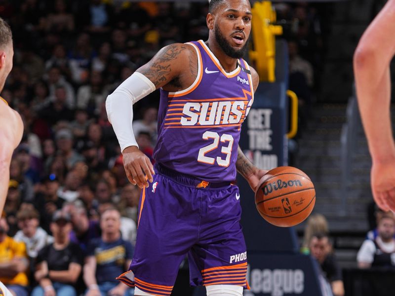 DENVER, CO - OCTOBER 13: Monte Morris #23 of the Phoenix Suns dribbles the ball during the game against the Denver Nuggets on October 13, 2024 at Ball Arena in Denver, Colorado. NOTE TO USER: User expressly acknowledges and agrees that, by downloading and/or using this Photograph, user is consenting to the terms and conditions of the Getty Images License Agreement. Mandatory Copyright Notice: Copyright 2024 NBAE (Photo by Garrett Ellwood/NBAE via Getty Images)