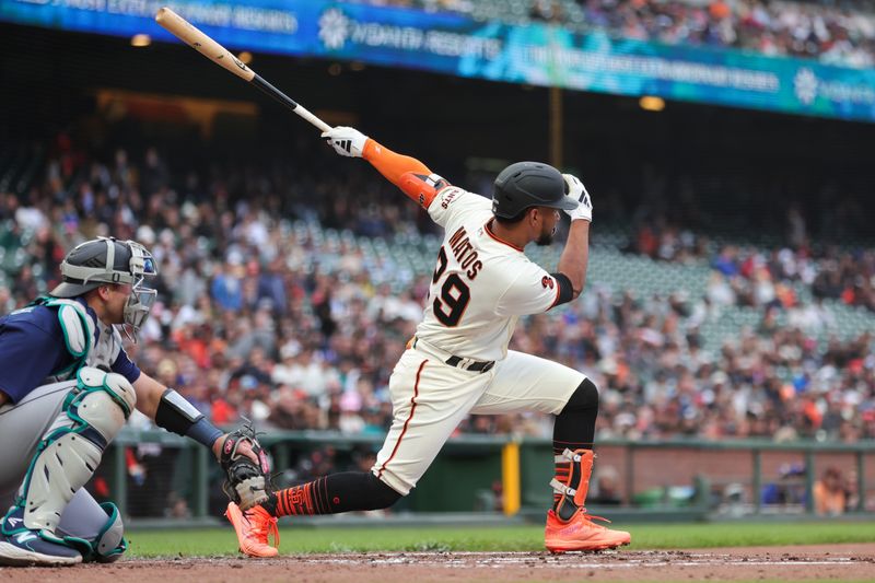 Jul 5, 2023; San Francisco, California, USA; San Francisco Giants outfielder Luis Matos (29) hits a single during the second inning against the Seattle Mariners at Oracle Park. Mandatory Credit: Sergio Estrada-USA TODAY Sports