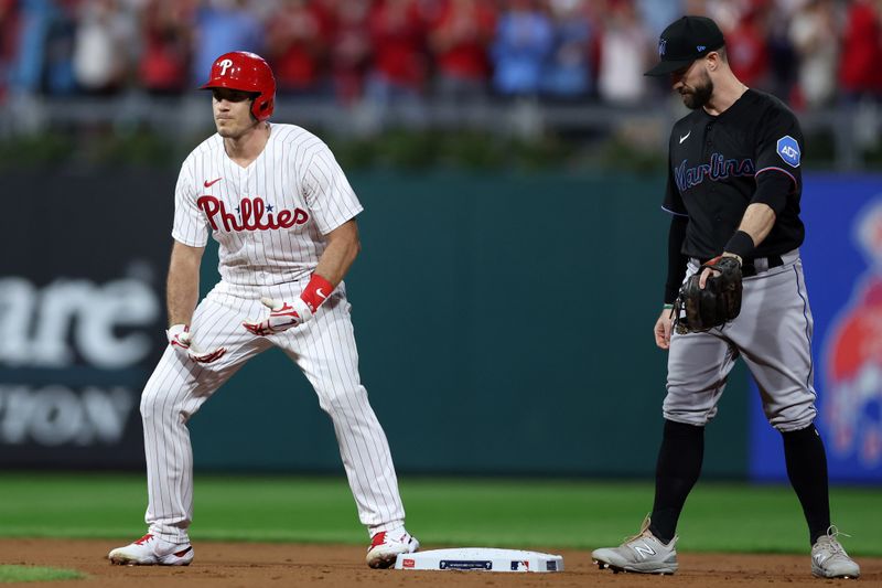 Oct 4, 2023; Philadelphia, Pennsylvania, USA; Philadelphia Phillies catcher J.T. Realmuto (10) reacts after hitting a double against the Miami Marlins during the second inning for game two of the Wildcard series for the 2023 MLB playoffs at Citizens Bank Park. Mandatory Credit: Bill Streicher-USA TODAY Sports