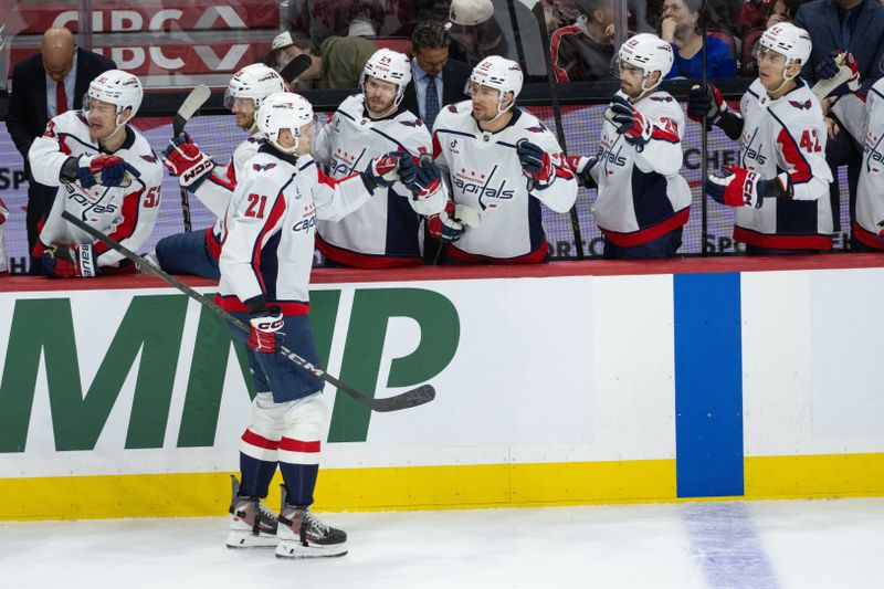 Jan 1, 2026; Ottawa, Ontario, CAN; Washington Capitals center Aliaksei Protas (21) celebrates with team his goal scored in the third period against the Ottawa Senators at the Canadian Tire Centre. Mandatory Credit: Marc DesRosiers-IMAGN Images