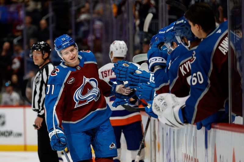 Oct 14, 2024; Denver, Colorado, USA; Colorado Avalanche center Calum Ritchie (71) celebrates with the bench after his goal in the first period against the New York Islanders at Ball Arena. Mandatory Credit: Isaiah J. Downing-Imagn Images