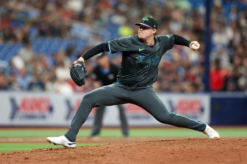 Jul 13, 2024; St. Petersburg, Florida, USA; Tampa Bay Rays pitcher Garrett Cleavinger (60) throws a pitch against the Cleveland Guardians in the eighth inning at Tropicana Field. Mandatory Credit: Nathan Ray Seebeck-USA TODAY Sports