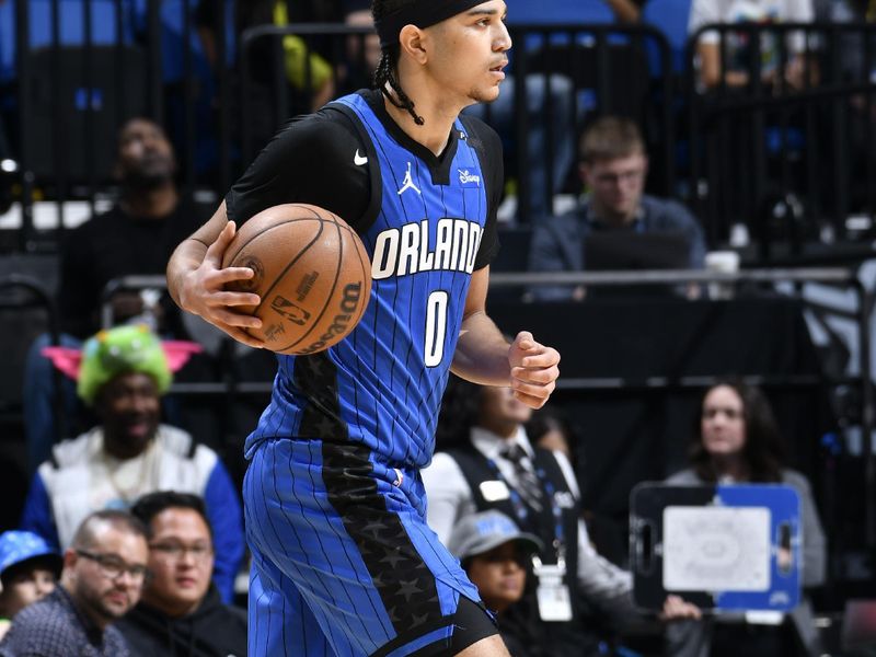 ORLANDO, FL - FEBRUARY 23:  Anthony Black #0 of the Orlando Magic passes the ball during the game against the Washington Wizards on February 23, 2025 at Kia Center in Orlando, Florida. NOTE TO USER: User expressly acknowledges and agrees that, by downloading and or using this photograph, User is consenting to the terms and conditions of the Getty Images License Agreement. Mandatory Copyright Notice: Copyright 2025 NBAE (Photo by Fernando Medina/NBAE via Getty Images)