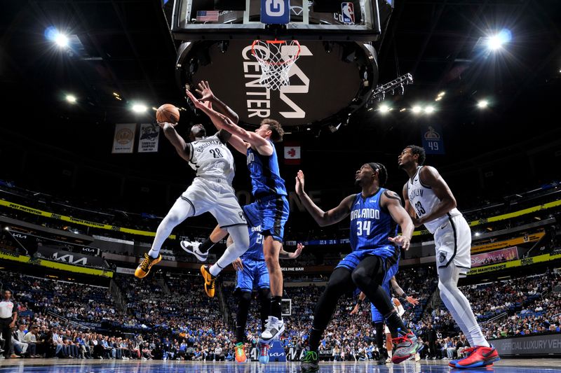 ORLANDO, FL - FEBRUARY 27: Dorian Finney-Smith #28 of the Brooklyn Nets drives to the basket during the game against the Orlando Magic on February 27, 2024 at the Kia Center in Orlando, Florida. NOTE TO USER: User expressly acknowledges and agrees that, by downloading and or using this photograph, User is consenting to the terms and conditions of the Getty Images License Agreement. Mandatory Copyright Notice: Copyright 2024 NBAE (Photo by Fernando Medina/NBAE via Getty Images)