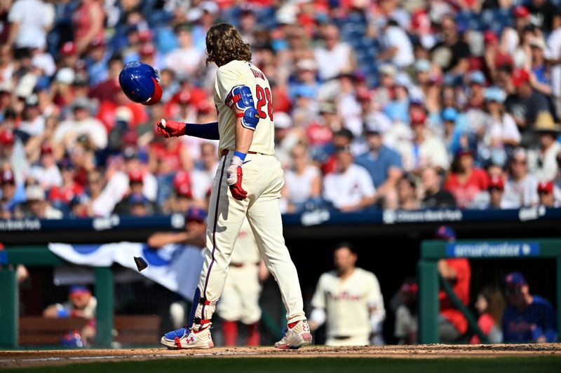 Jul 13, 2024; Philadelphia, Pennsylvania, USA; Philadelphia Phillies infielder Alec Bohm (28) breaks his helmet after striking out against the Oakland Athletics in the fourth inning at Citizens Bank Park. Mandatory Credit: Kyle Ross-USA TODAY Sports