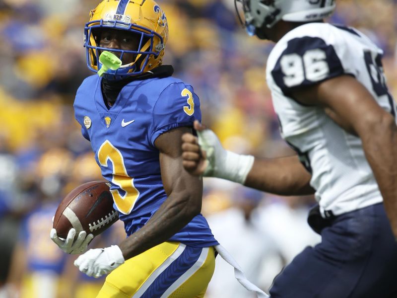 Sep 25, 2021; Pittsburgh, Pennsylvania, USA;  Pittsburgh Panthers wide receiver Jordan Addison (3) runs after a catch on his way to scoring a touchdown as New Hampshire Wildcats defensive end Josiah Silver (96)  chases during the second quarter at Heinz Field. Mandatory Credit: Charles LeClaire-USA TODAY Sports