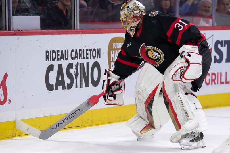 Feb 22, 2024; Ottawa, Ontario, CAN; Ottawa Senators goalie Anton Forsberg (31) recovers his stick which got wedged in the boards during the second period against the Dallas Stars at the Canadian Tire Centre. Mandatory Credit: Marc DesRosiers-USA TODAY Sports