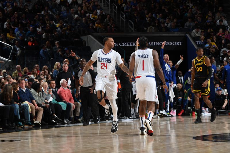 SAN FRANCISCO, CA - FEBRUARY 14: Norman Powell #24 high fives James Harden #1 of the LA Clippers during the game against the Golden State Warriors on FEBRUARY 14, 2024 at Chase Center in San Francisco, California. NOTE TO USER: User expressly acknowledges and agrees that, by downloading and or using this photograph, user is consenting to the terms and conditions of Getty Images License Agreement. Mandatory Copyright Notice: Copyright 2024 NBAE (Photo by Noah Graham/NBAE via Getty Images)