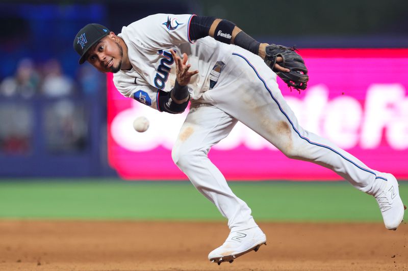 Jul 30, 2023; Miami, Florida, USA; Miami Marlins second baseman Luis Arraez (3) throws to first and retires Detroit Tigers center fielder Riley Greene (not pictured) during the eighth inning at loanDepot Park. Mandatory Credit: Sam Navarro-USA TODAY Sports