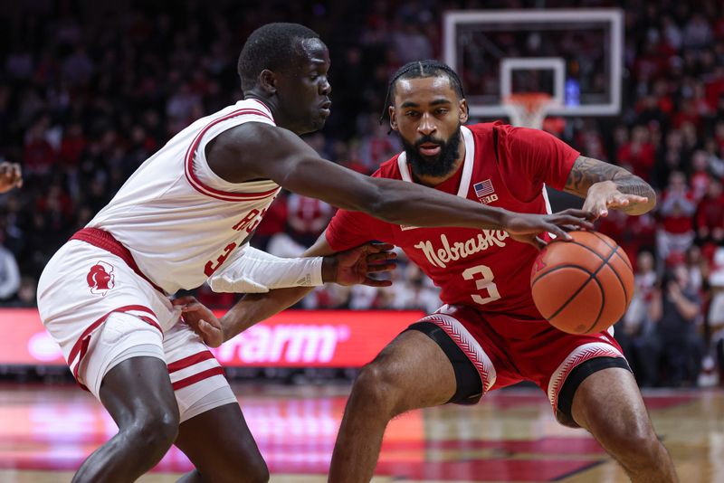 Jan 17, 2024; Piscataway, New Jersey, USA; Rutgers Scarlet Knights forward Mawot Mag (3) looks to steal the  ball from Nebraska Cornhuskers guard Brice Williams (3)  during the first half at Jersey Mike's Arena. Mandatory Credit: Vincent Carchietta-USA TODAY Sports