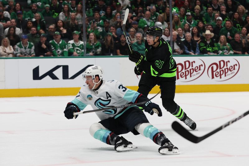 Apr 13, 2024; Dallas, Texas, USA; Dallas Stars left wing Jason Robertson (21) scores a power play goal against the Seattle Kraken in the second period at American Airlines Center. Mandatory Credit: Tim Heitman-USA TODAY Sports