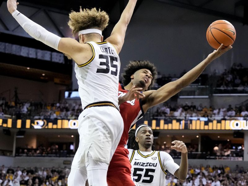 Mar 4, 2023; Columbia, Missouri, USA; Mississippi Rebels forward Jaemyn Brakefield (4) shoots as Missouri Tigers forward Noah Carter (35) defends during the second half at Mizzou Arena. Mandatory Credit: Denny Medley-USA TODAY Sports