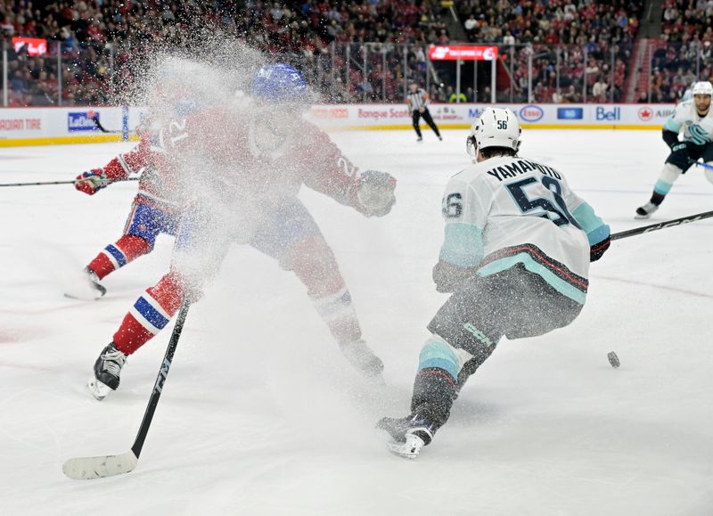 Dec 4, 2023; Montreal, Quebec, CAN; Montreal Canadiens defenseman Kaiden Guhle (21) gets some snow while defending against Seattle Kraken forward Kailer Yamamoto (56) during the first period at the Bell Centre. Mandatory Credit: Eric Bolte-USA TODAY Sports