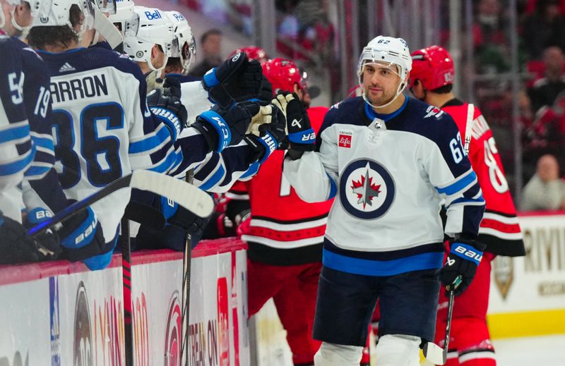 Mar 2, 2024; Raleigh, North Carolina, USA; Winnipeg Jets right wing Nino Niederreiter (62) celebrates his goal against the Carolina Hurricanes during the third period at PNC Arena. Mandatory Credit: James Guillory-USA TODAY Sports