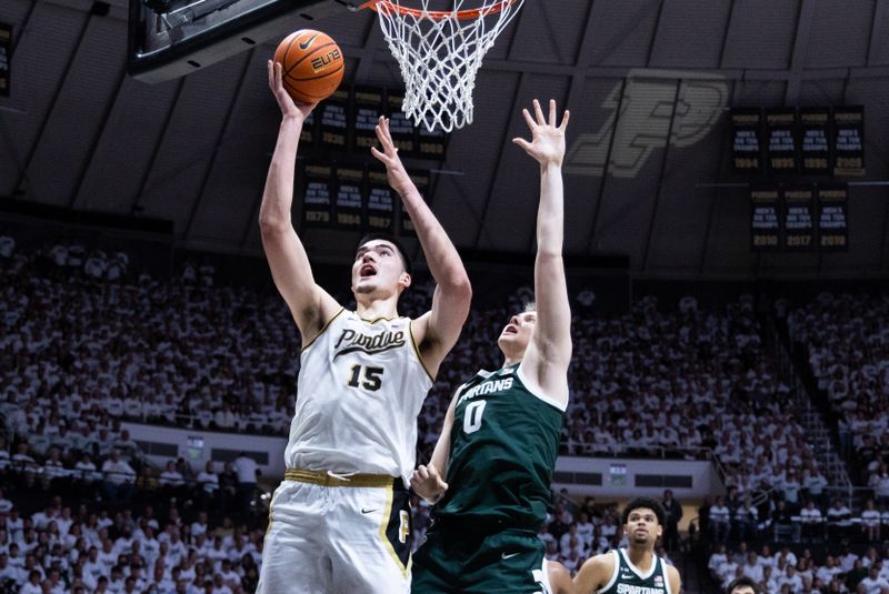 Jan 29, 2023; West Lafayette, Indiana, USA;  Purdue Boilermakers center Zach Edey (15) shoots the ball while Michigan State Spartans forward Jaxon Kohler (0) defends in the second half at Mackey Arena. Mandatory Credit: Trevor Ruszkowski-USA TODAY Sports