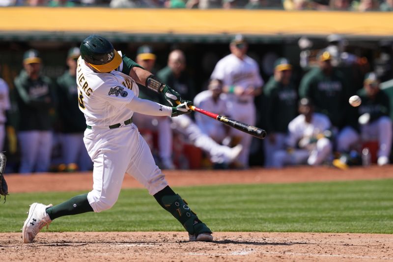 Apr 16, 2023; Oakland, California, USA; Oakland Athletics catcher Shea Langeliers (23) hits an RBI double against the New York Mets during the eighth inning at RingCentral Coliseum. Mandatory Credit: Darren Yamashita-USA TODAY Sports