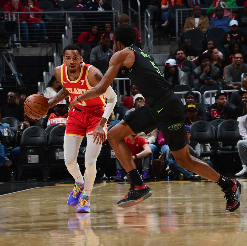 ATLANTA, GA - MARCH 10: Dejounte Murray #5 of the Atlanta Hawks dribbles the ball during the game against the New Orleans Pelicans on March 10, 2024 at State Farm Arena in Atlanta, Georgia.  NOTE TO USER: User expressly acknowledges and agrees that, by downloading and/or using this Photograph, user is consenting to the terms and conditions of the Getty Images License Agreement. Mandatory Copyright Notice: Copyright 2024 NBAE (Photo by Scott Cunningham/NBAE via Getty Images)