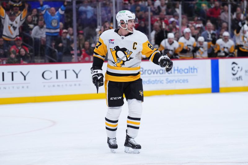 Jan 3, 2025; Sunrise, Florida, USA; Pittsburgh Penguins center Sidney Crosby (87) reacts after scoring against the Florida Panthers during the second period at Amerant Bank Arena. Mandatory Credit: Rich Storry-Imagn Images