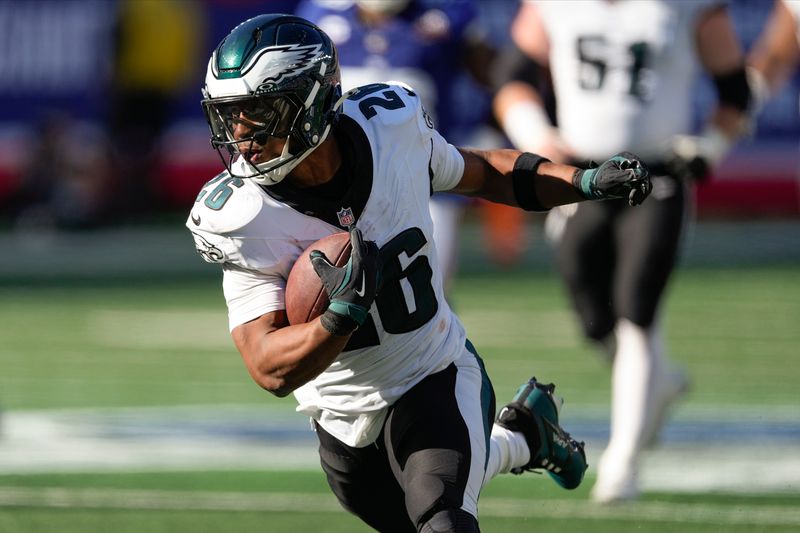 Philadelphia Eagles running back Saquon Barkley (26) carries the ball against the New York Giants during the third quarter of an NFL football game, Sunday, Oct. 20, 2024, in East Rutherford, N.J. (AP Photo/Seth Wenig)