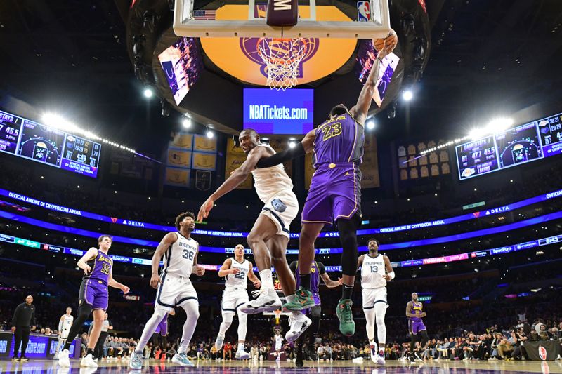 LOS ANGELES, CA - JANUARY 5: LeBron James #23 of the Los Angeles Lakers drives to the basket during the game against the Memphis Grizzlies on January 5, 2024 at Crypto.Com Arena in Los Angeles, California. NOTE TO USER: User expressly acknowledges and agrees that, by downloading and/or using this Photograph, user is consenting to the terms and conditions of the Getty Images License Agreement. Mandatory Copyright Notice: Copyright 2024 NBAE (Photo by Adam Pantozzi/NBAE via Getty Images)