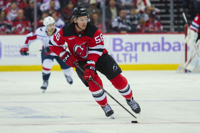 Nov 30, 2024; Newark, New Jersey, USA; New Jersey Devils left wing Erik Haula (56) skates with the puck against the Washington Capitals during the second period at Prudential Center. Mandatory Credit: Thomas Salus-Imagn Images