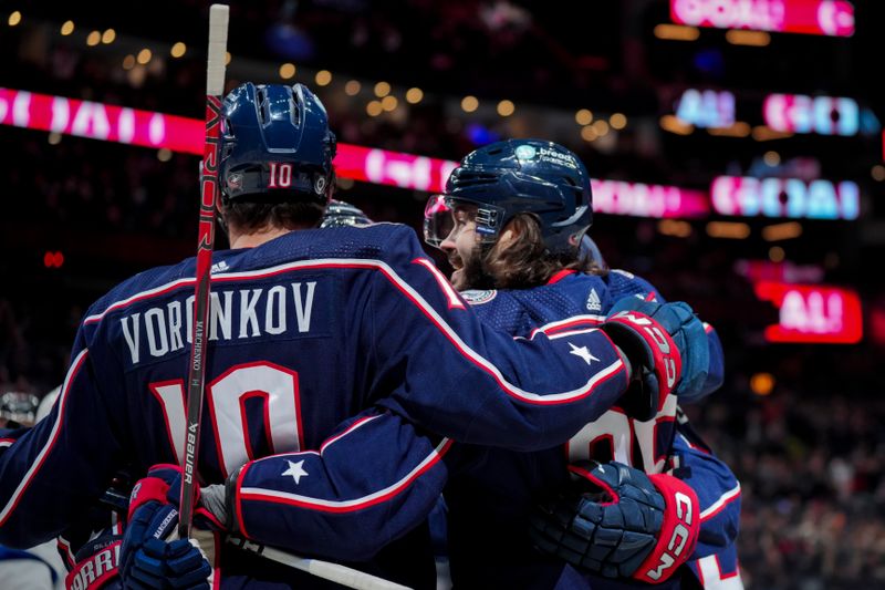 Nov 2, 2023; Columbus, Ohio, USA;  Columbus Blue Jackets left wing Kirill Marchenko (86) celebrates with teammates after scoring a goal against the Tampa Bay Lightning in the first period at Nationwide Arena. Mandatory Credit: Aaron Doster-USA TODAY Sports