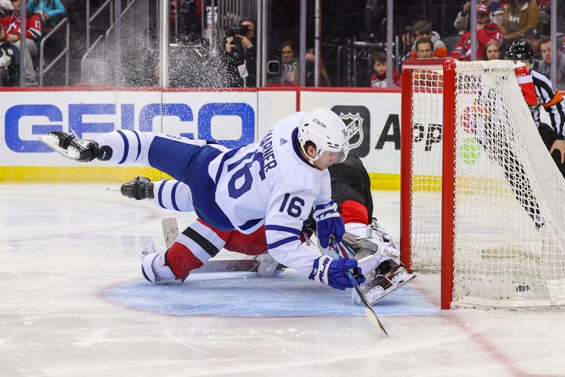 Mar 7, 2023; Newark, New Jersey, USA; Toronto Maple Leafs right wing Mitchell Marner (16) scores a goal on New Jersey Devils goaltender Vitek Vanecek (41) during the third period at Prudential Center. Mandatory Credit: Ed Mulholland-USA TODAY Sports