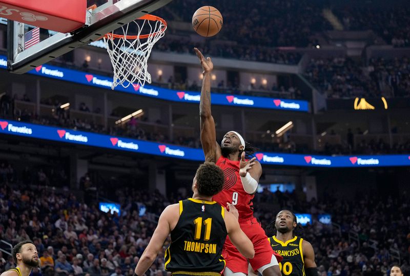 SAN FRANCISCO, CALIFORNIA - DECEMBER 23: Jerami Grant #9 of the Portland Trail Blazers shoots over Klay Thompson #11 of the Golden State Warriors during the first half at Chase Center on December 23, 2023 in San Francisco, California. NOTE TO USER: User expressly acknowledges and agrees that, by downloading and or using this photograph, User is consenting to the terms and conditions of the Getty Images License Agreement. (Photo by Thearon W. Henderson/Getty Images)